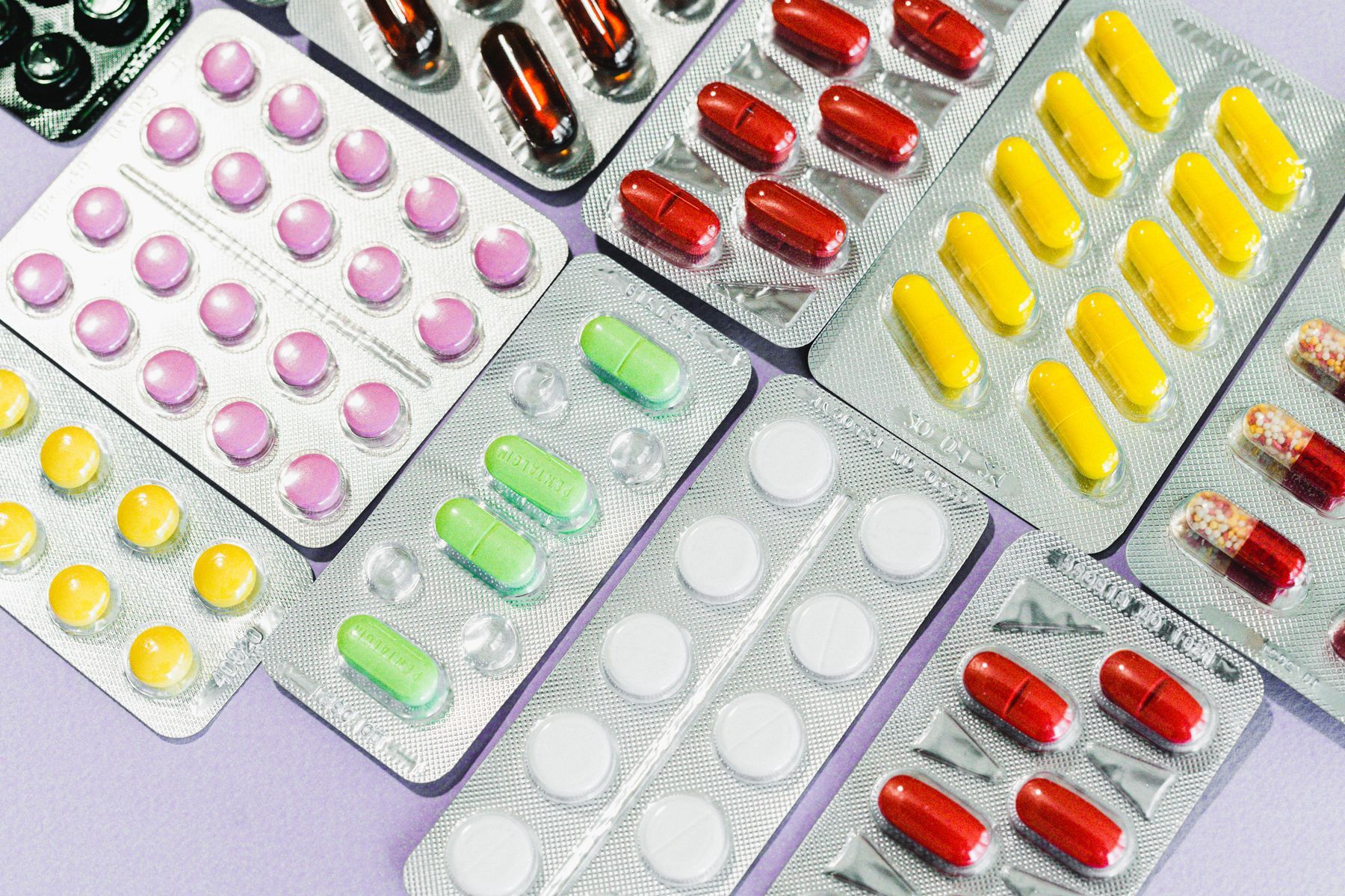 Blister packs of orange and pink tablets